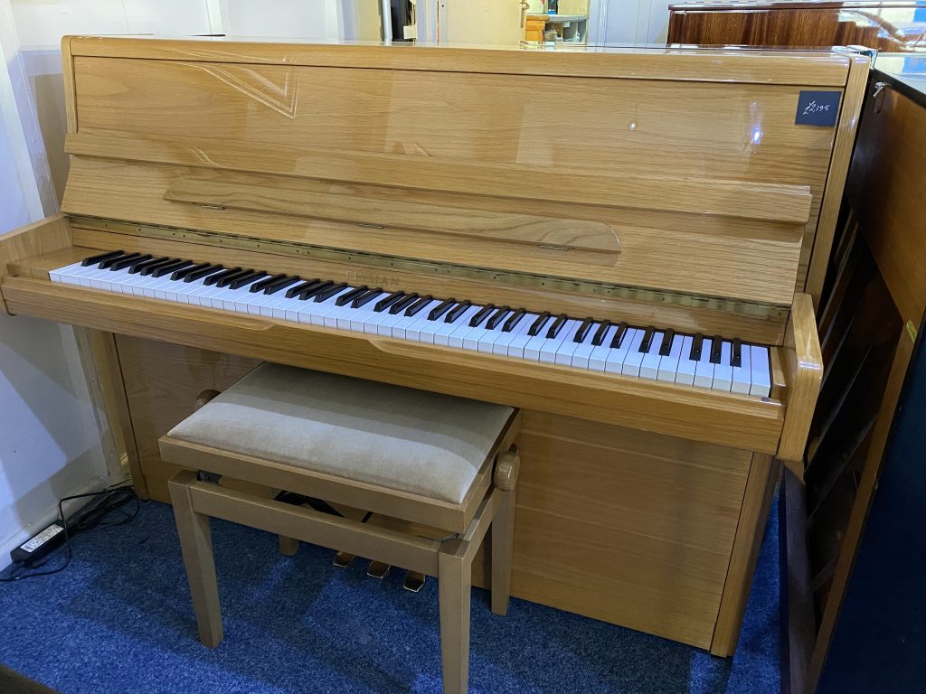 Elysian modern upright piano in oak